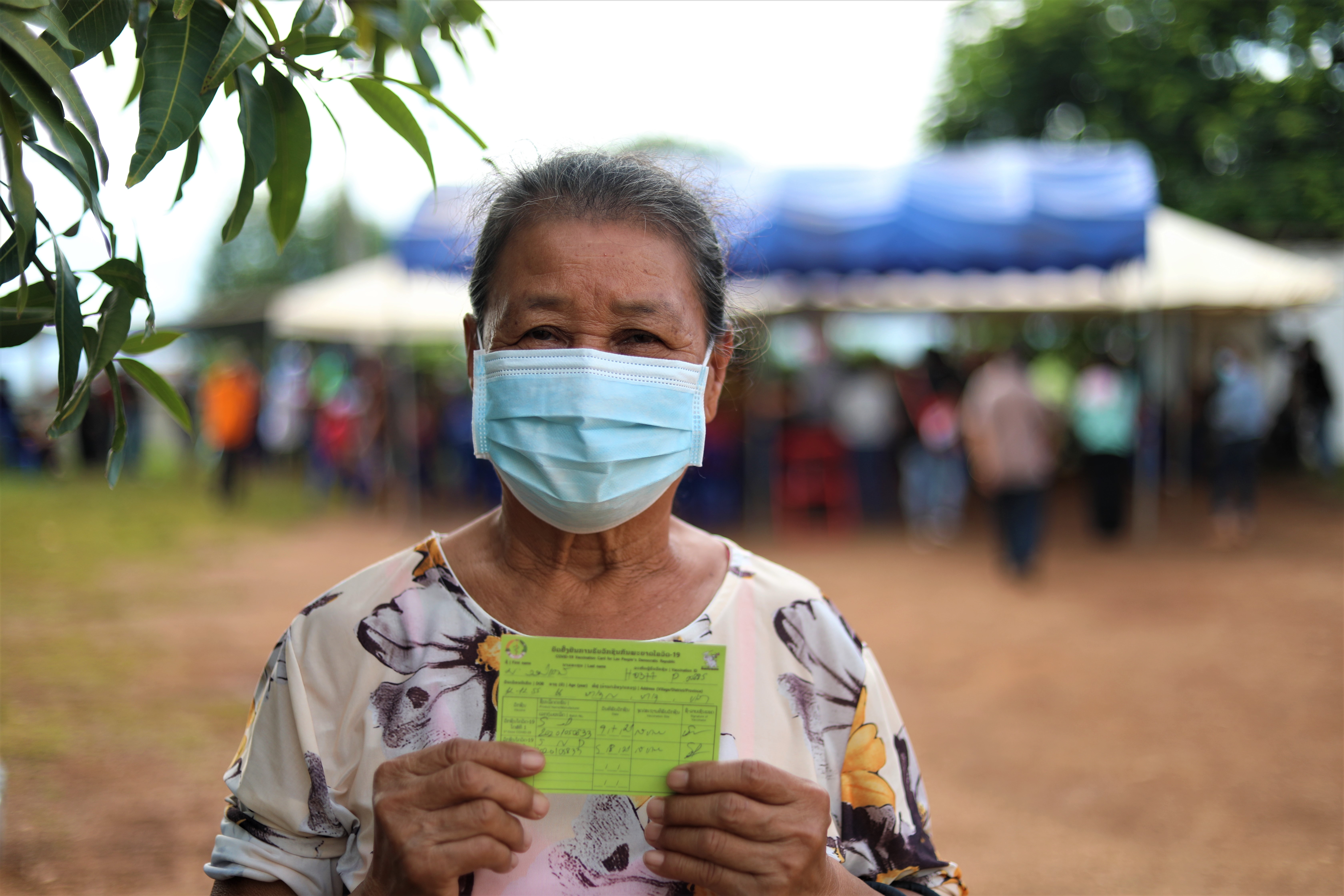 Auntie Onkeo with her vaccination card