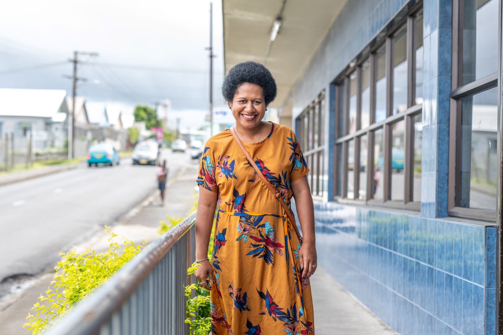 IMG_2873 Portrait of Divisional Nurse Coordinator, Udila Tawake, in front of the Ministry of Health in Suva, Fiji.